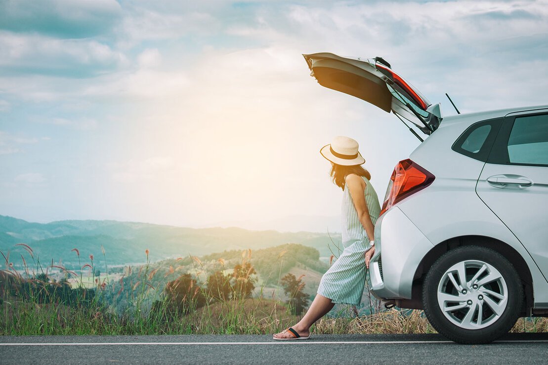 User searching for rental cars on a laptop